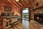 King bedroom with fireplace on the upper level